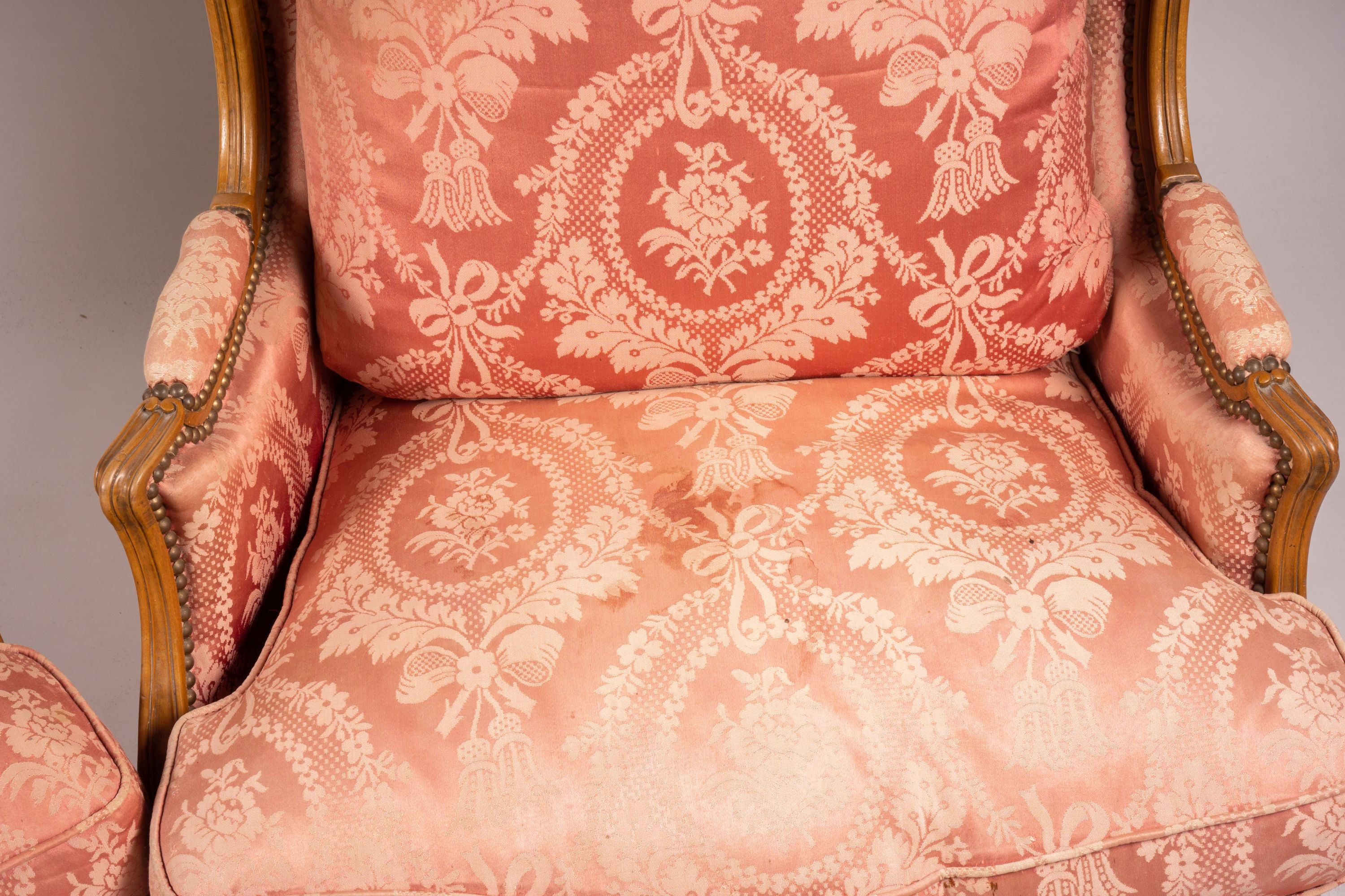 A pair of early 20th century French carved beech armchairs, width 75cm, depth 78cm, height 110cm